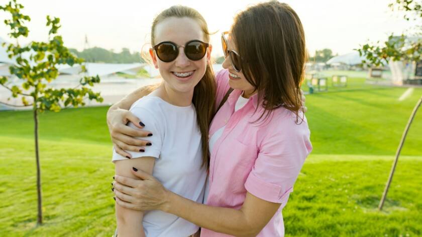 Communication of the parent and adolescent, mother hugging daughter